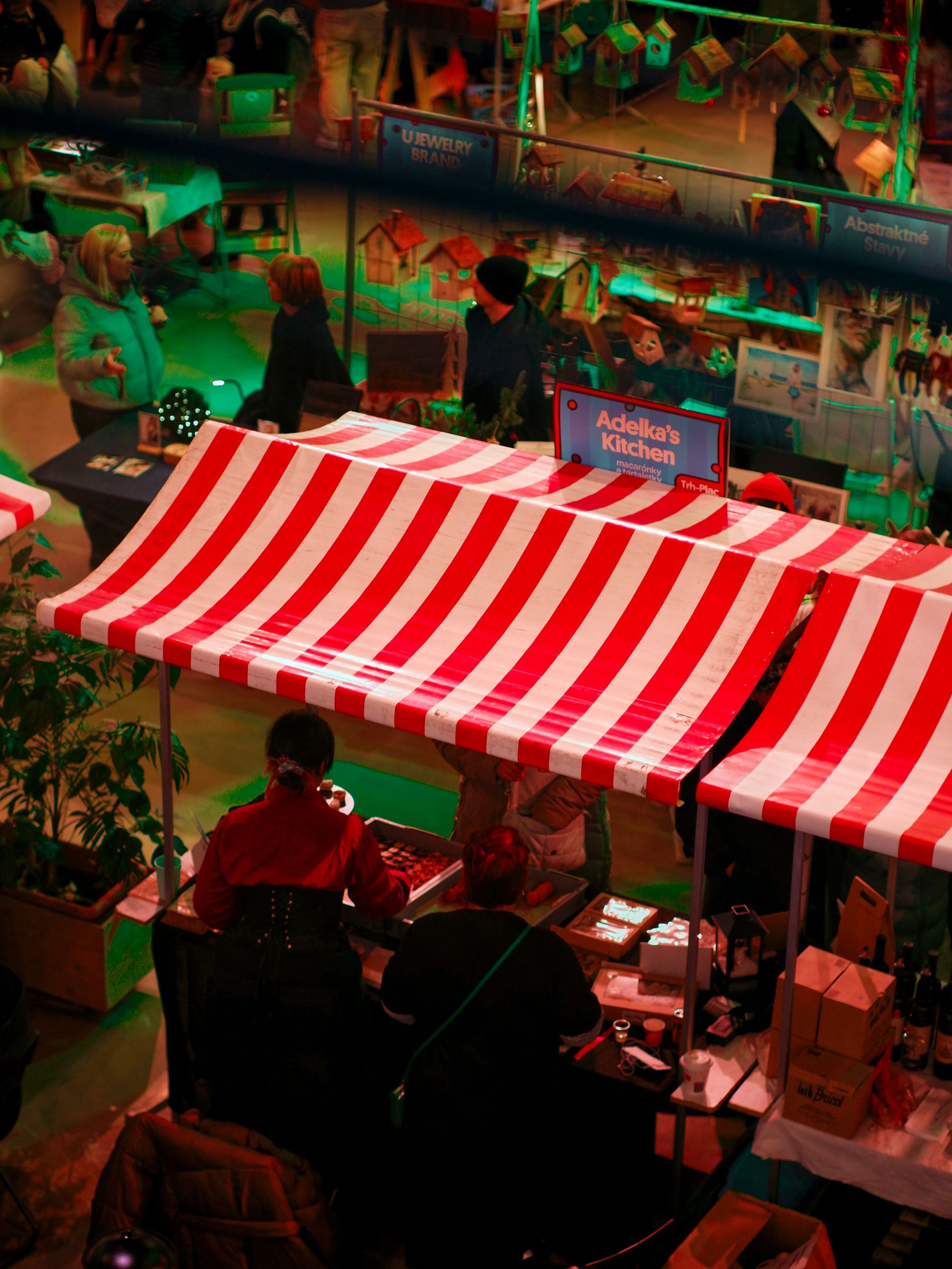 Red and white striped canopies sheltering a carnival stand