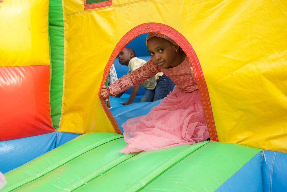 Child playing inside a bounce house