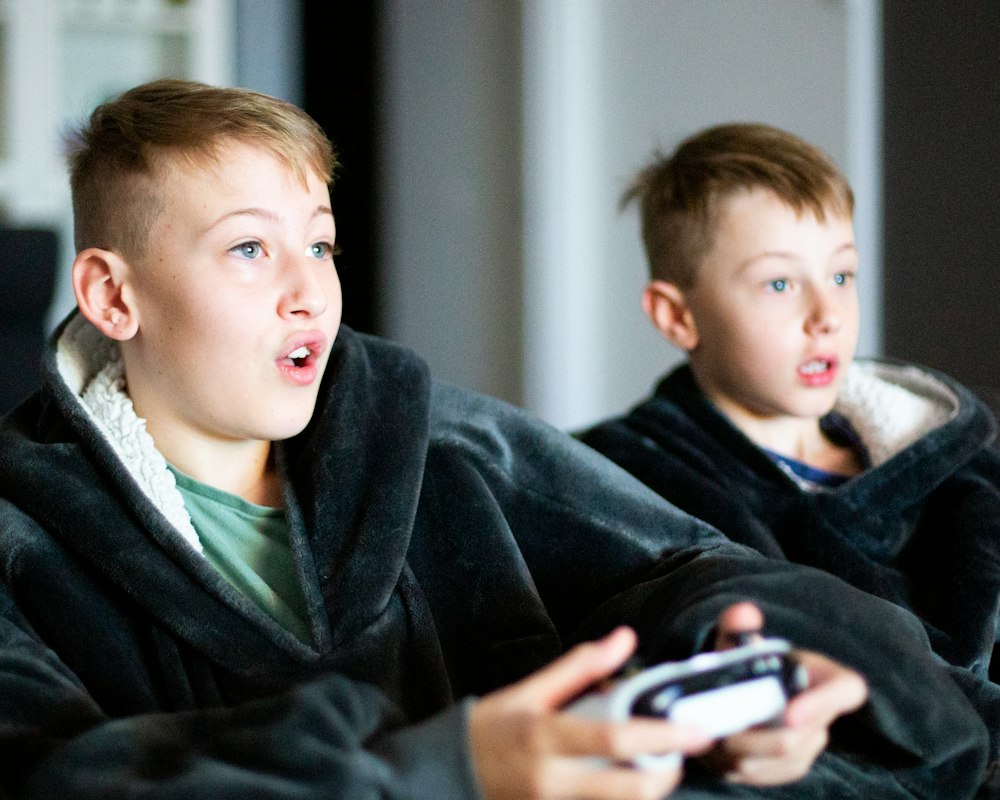 Kids playing video games together