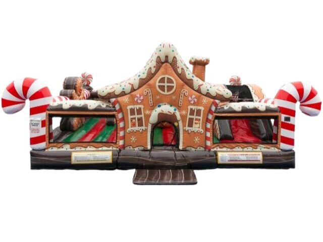 A gingerbread house inflatable playland with peppermint posts