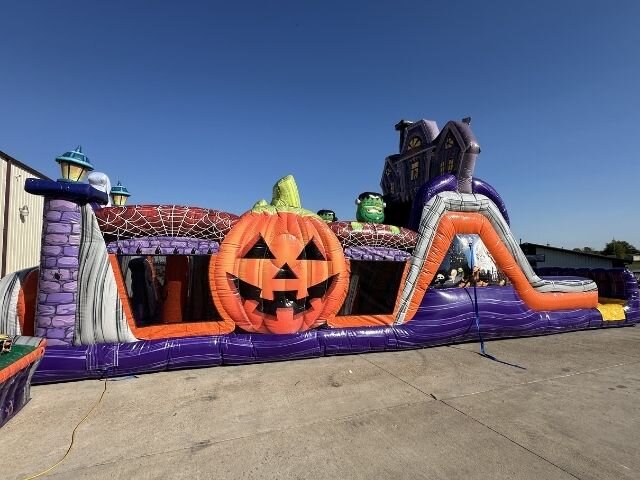 A long haunted obstacle course with a giant pumpkin