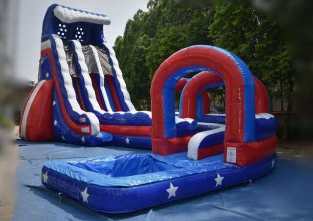 A red, white and blue dual-lane water slide