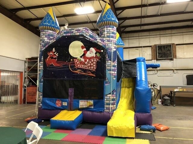 A Santa-themed bounce and slide combo