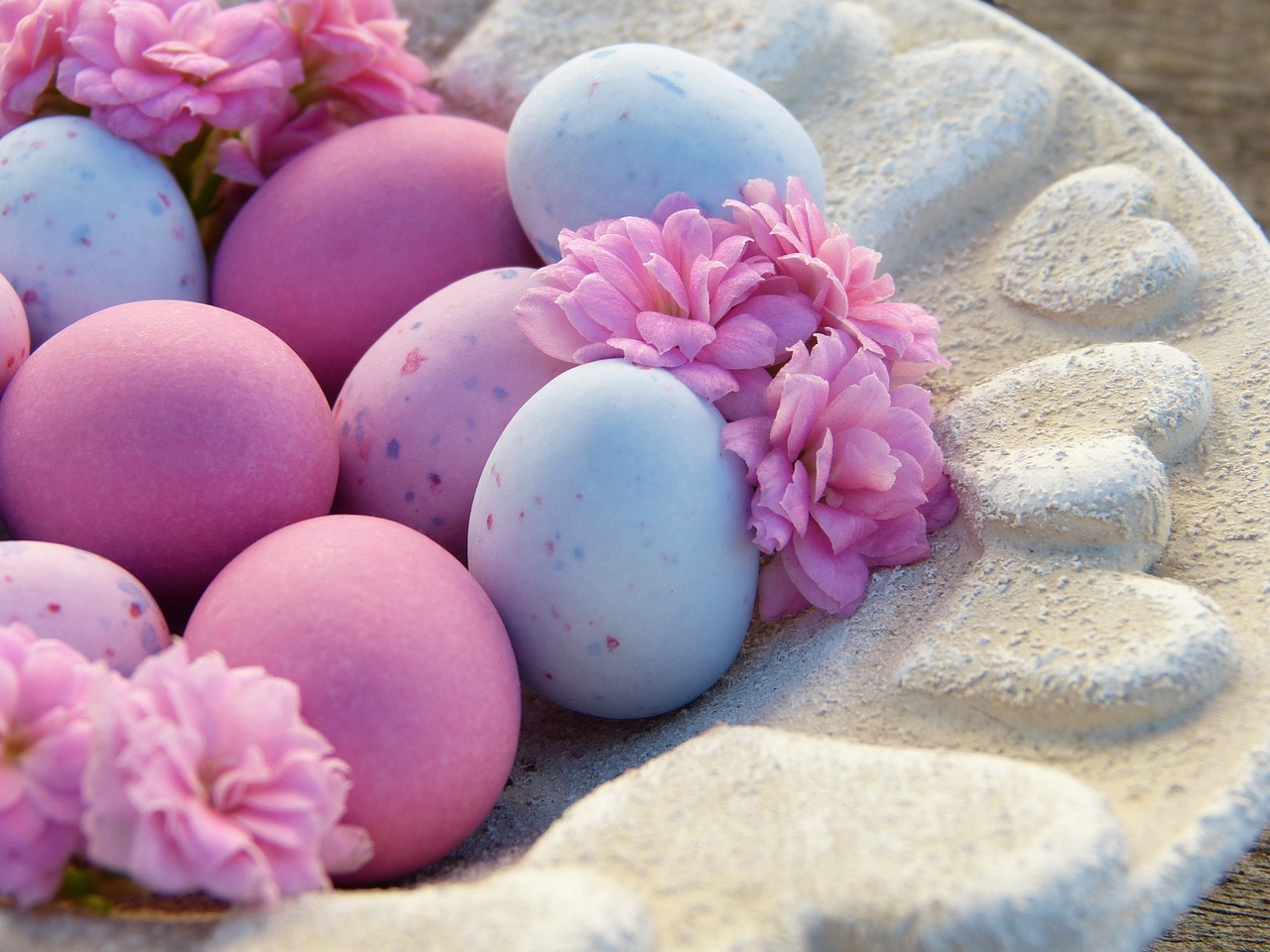 Pastel Easter eggs with spring flowers