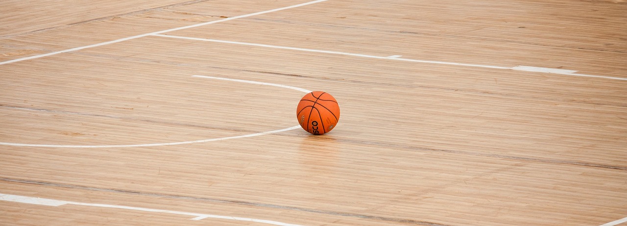 A basketball on a gym floor