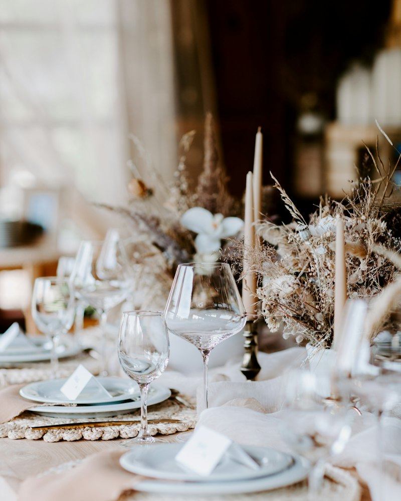 A reception table set with florals and candles
